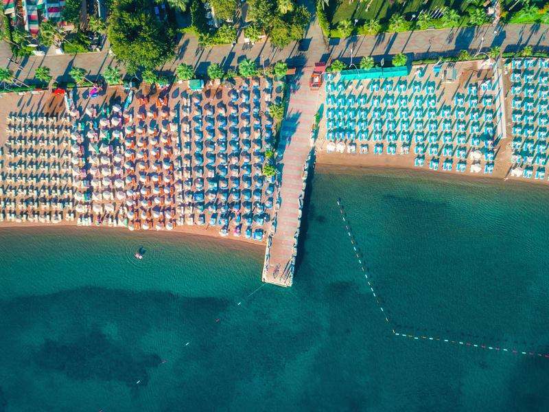 The beach from above in the holiday resort of Icmeler pops with color.