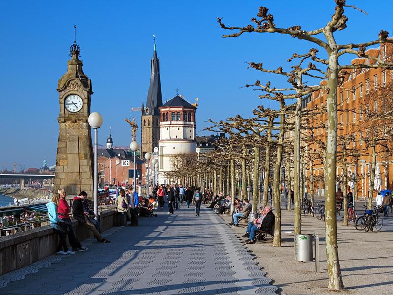 People on the Rhine embankment promenade in Dusseldorf.