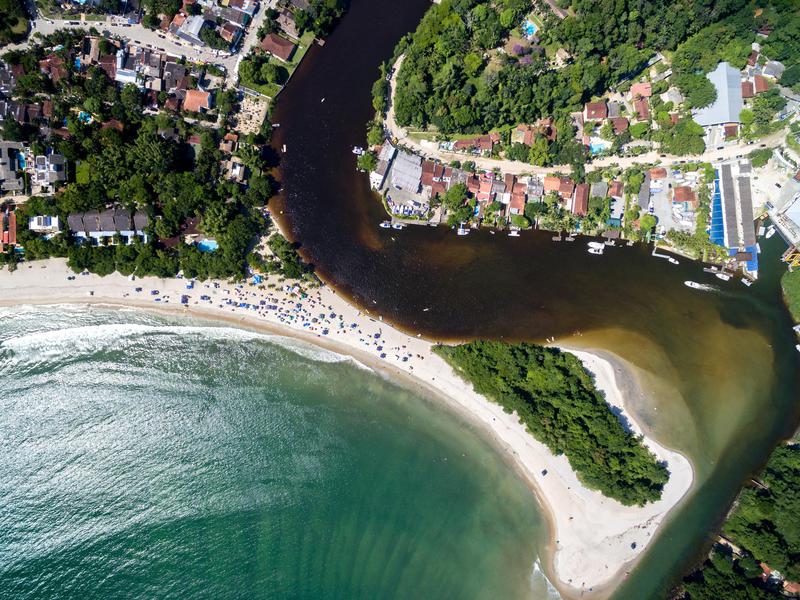 Sea meets white sand meets river meets land in Sao Paulo.