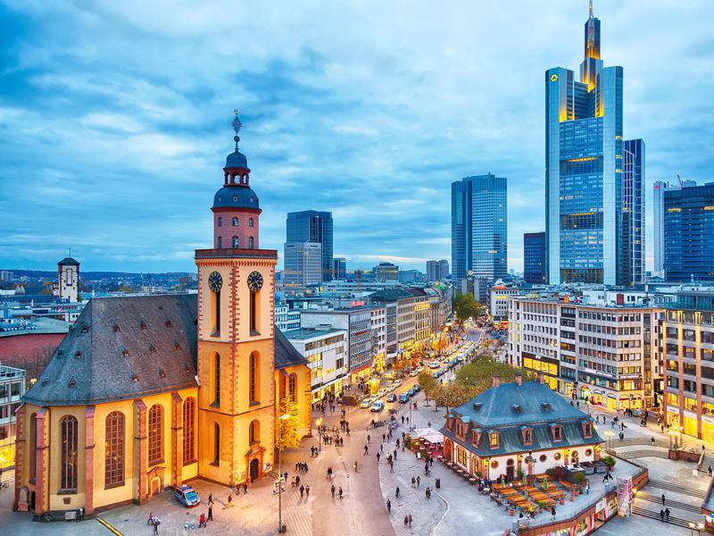 Frankfurt at sunset, with St Paul's Church and the Hauptwache Main Guard building.