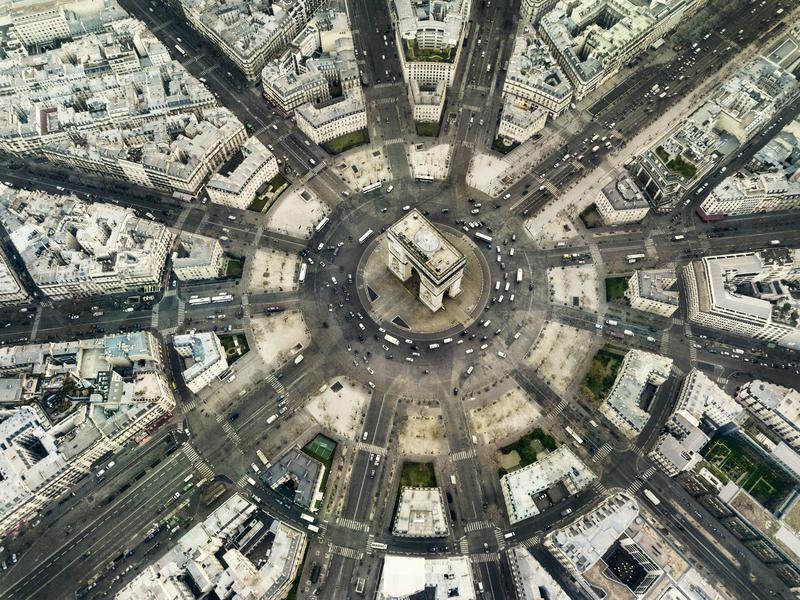 The iconic Arc de Triomphe is the center of activity in Paris.